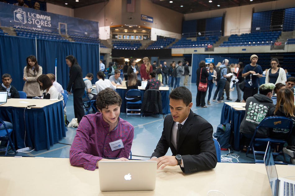 A student talks with an advisor in a conference.