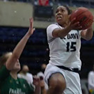 Woman shoots basketball