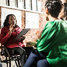 Woman speaks to group