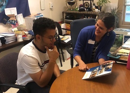 Hesham Ahmed is a senior transfer student studying Managerial Economics. He is also a Reception Intake Intern at the Internship and Career Center. Here he is talking with Lynn Fowler, Senior Career Advisor about the Career Resource Manual. Picture by Adriane Boykin, ICC, UCD.