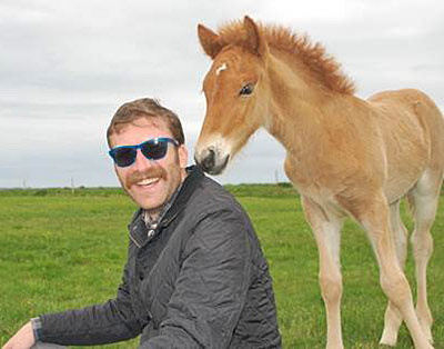 Erick Loomis with colt in field