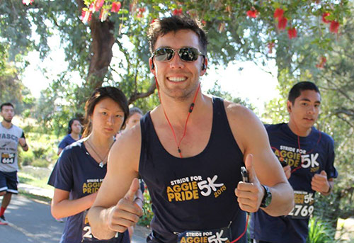 Young man running wearing racing togs