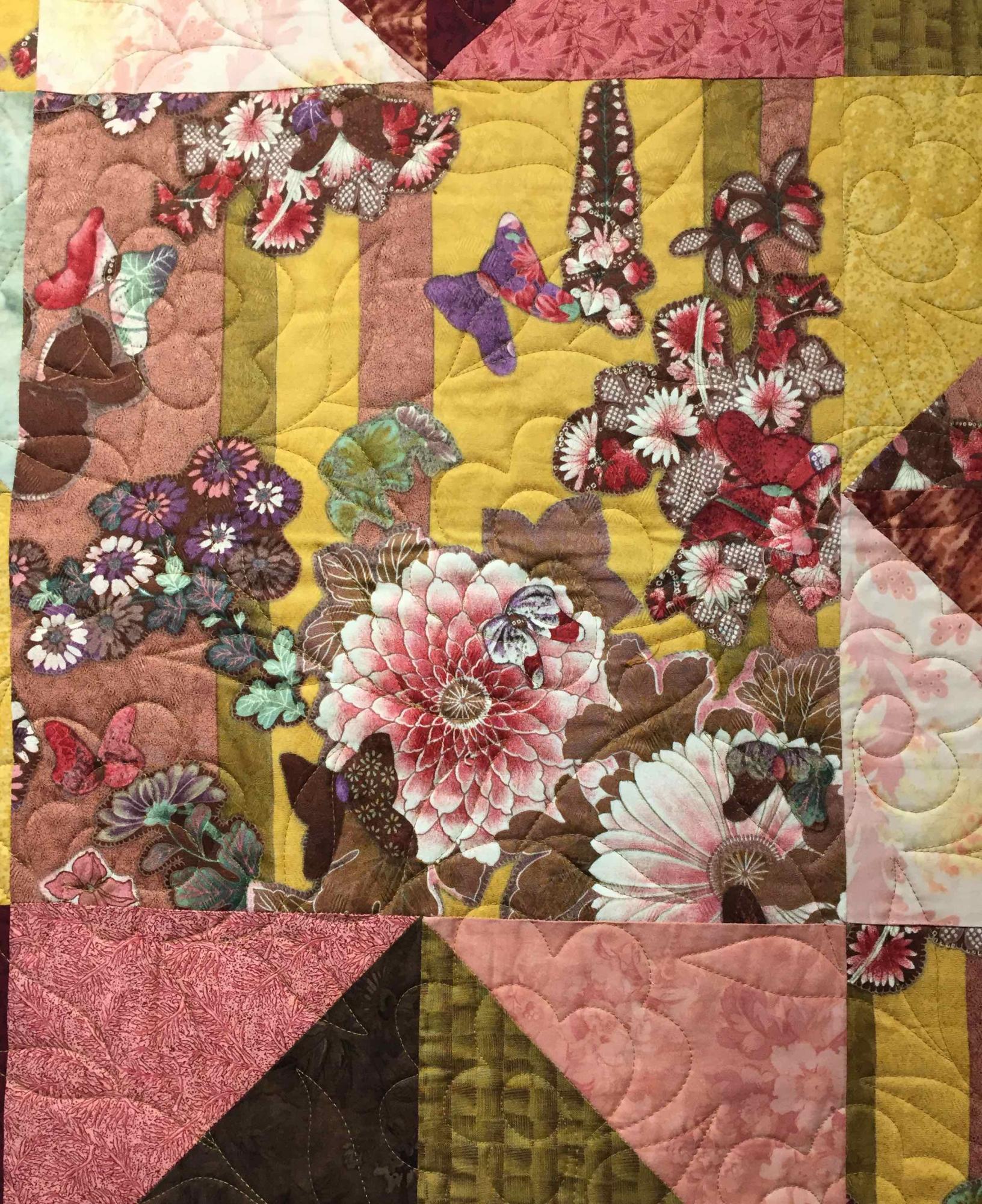 Poulos works initially from a "visual keystone" fabric and builds out. This is the focal point of "Hawaiin Melody" quilt.