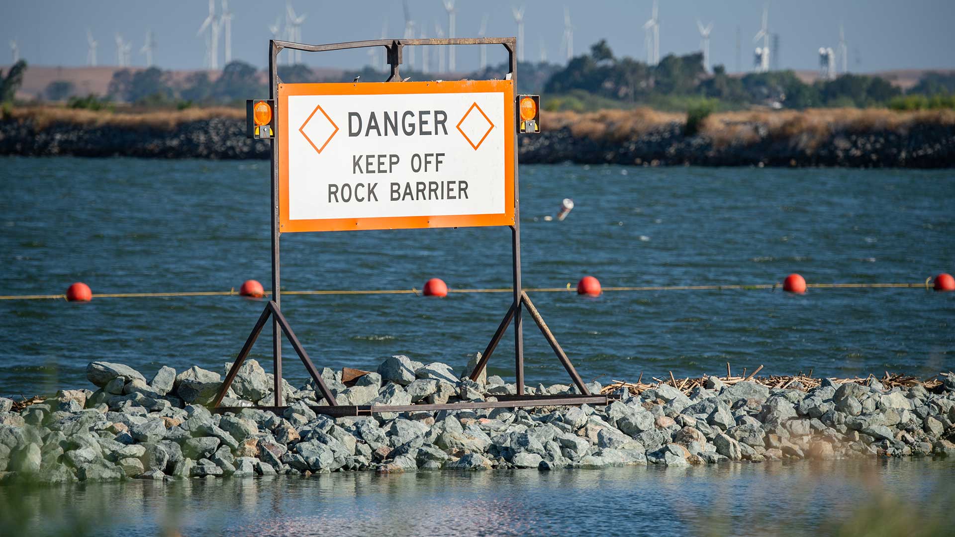 2021_07_13_JW_051_Drought_Barrier A rock barrier spans a river