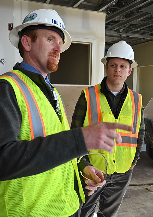 DrTommySaborido-construction-web Louis Ward, left, CEO of Mayers Memorial Hospital District, and Saborido look over the construction of the hospital's new outpatient clinic for primary care medicine.