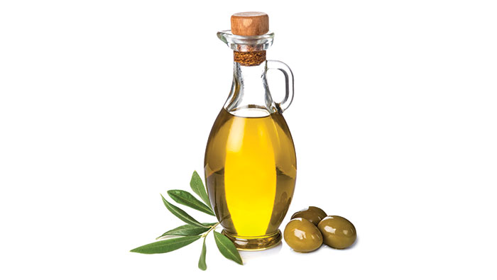 GettyImages-527798985 Bottle of oil, leaves and olives