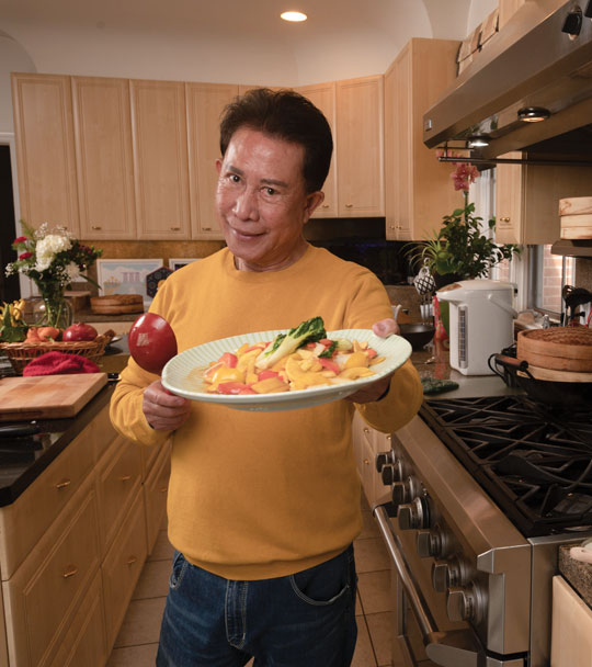 Martin-Yan-2 Chef Martin Yan holds plate of food