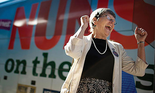 Nuns-on-the-bus-inset Sister Simone Campbell greets supporters at a stop in South Bend, Indiana, on the first Nuns on the Bus tour in 2012.
