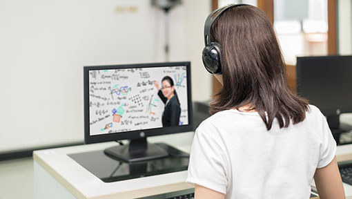 Online-lecture-web Student watches lecture on computer.