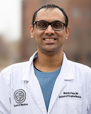 Patel-inset Moksha Patel in white lab coat