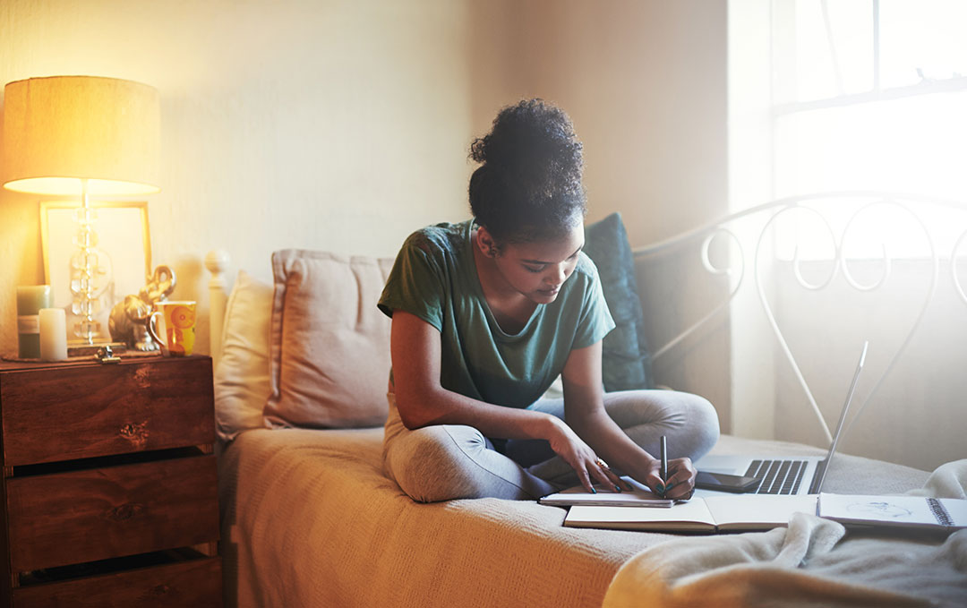 Student-works-from-home-web UC Davis students will take spring quarter classes remotely.