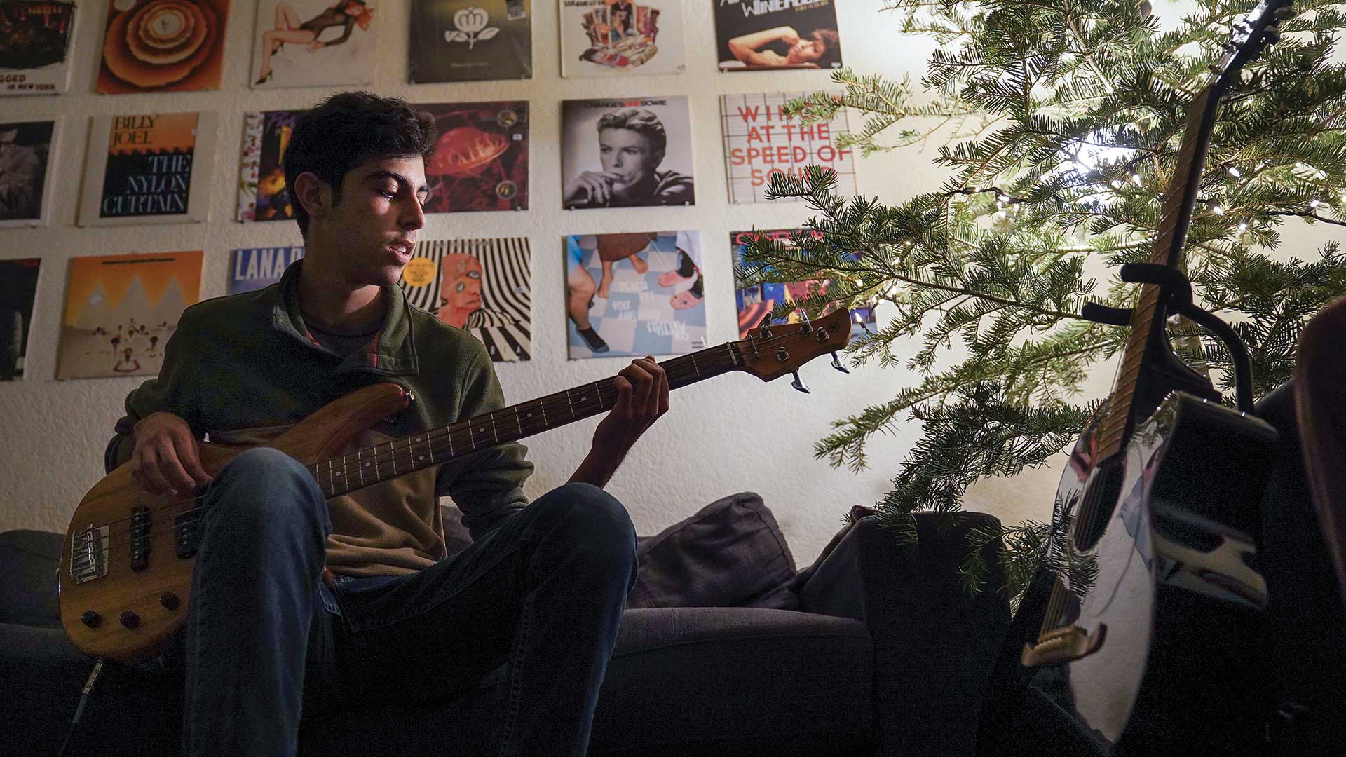 portraits-diaz a student plays the guitar