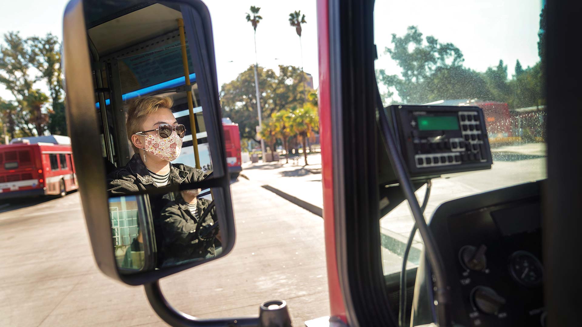 portraits-linnenbach A person drives a Unitrans bus