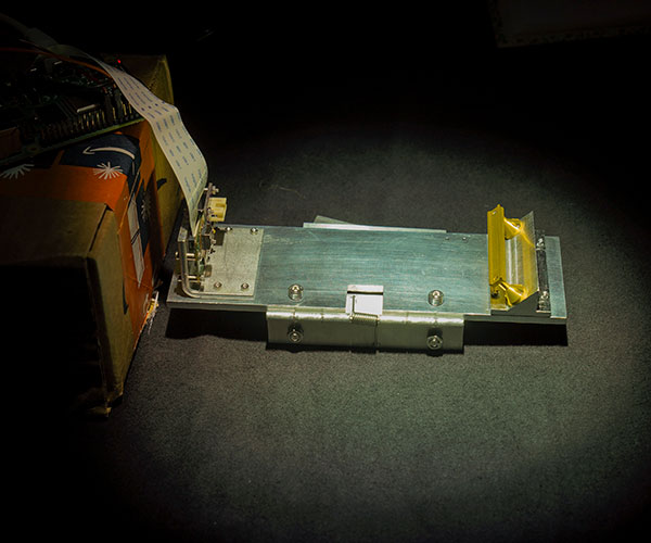 satellite-theater-inset mini replica of a handrail on the International Space Station