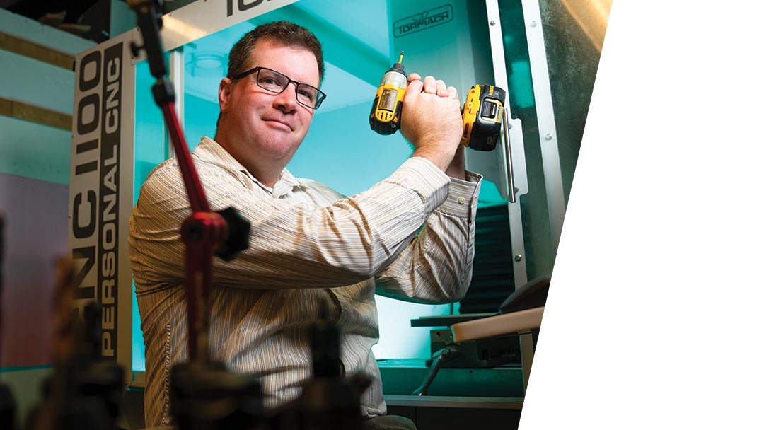 startup-uc-davis-tim-keller-inventopia Tim Keller with a drill and CNC machine