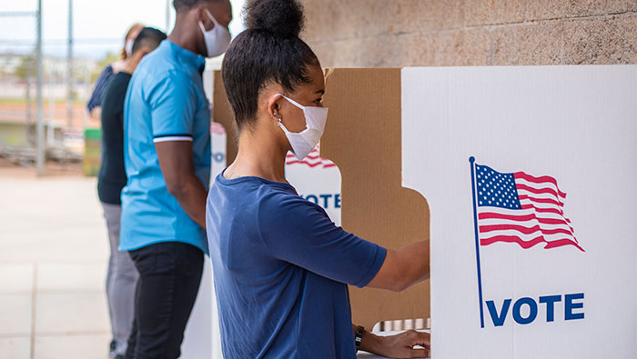 voting-booth-700x395-web Voters voting in outdoor booths