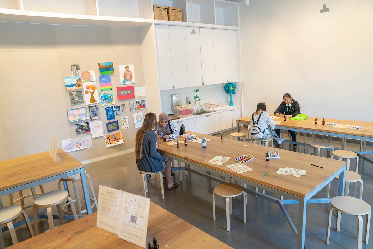 in Carol and Gerry Park Art Studio students work on art