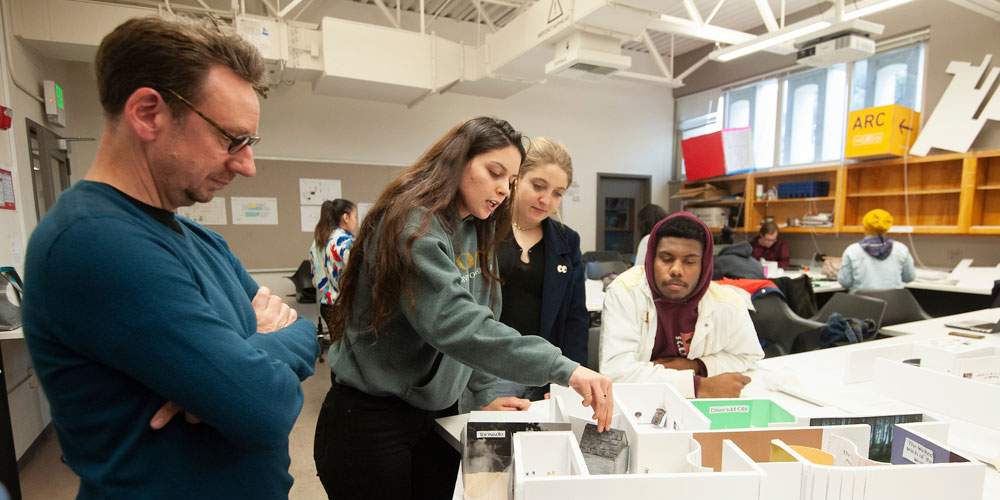 Students evaluate an interior design model