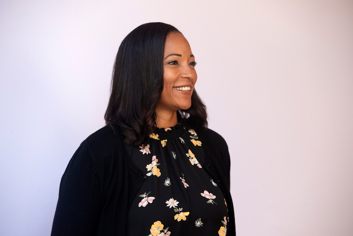 African American female scientist profile shot with light background