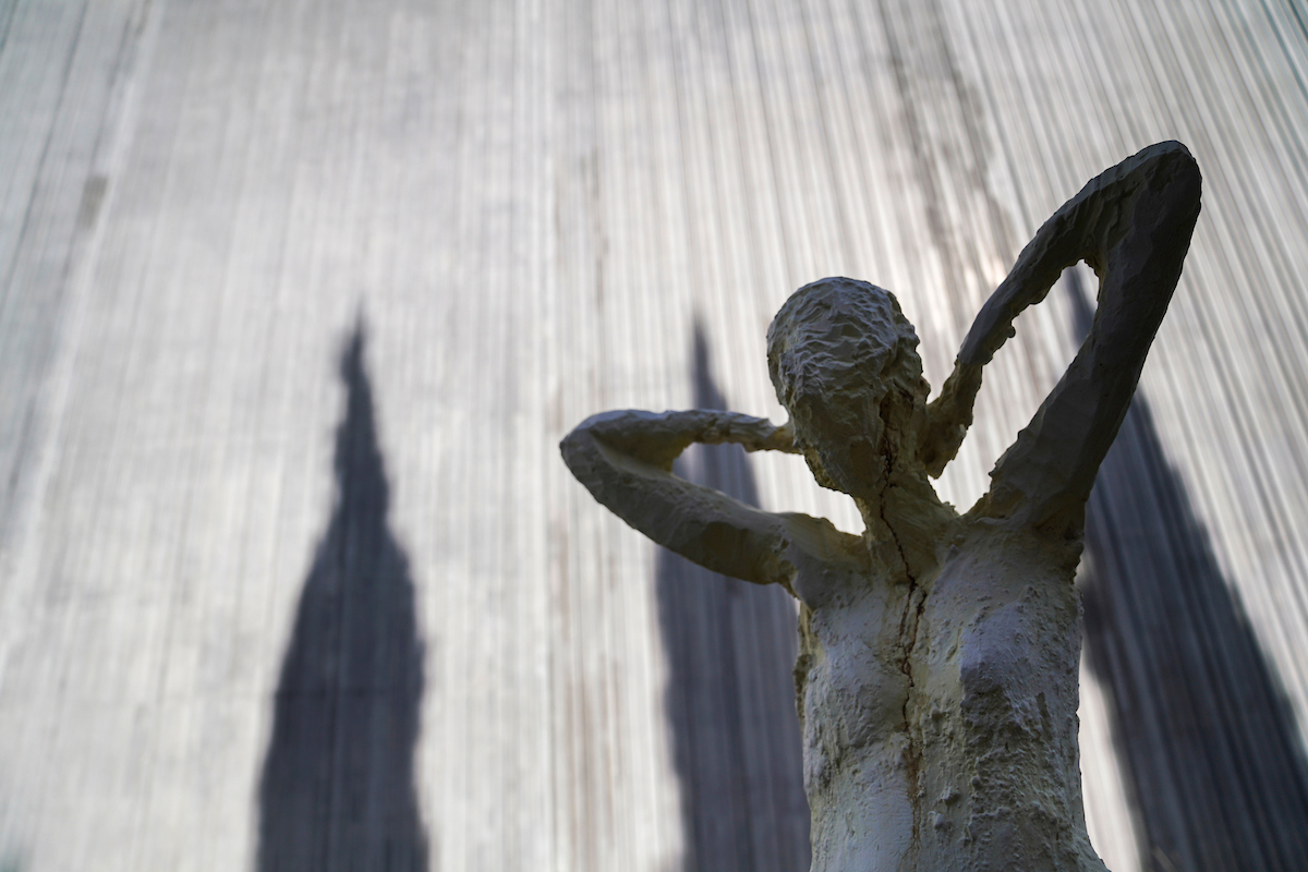 A human form statue in shadow