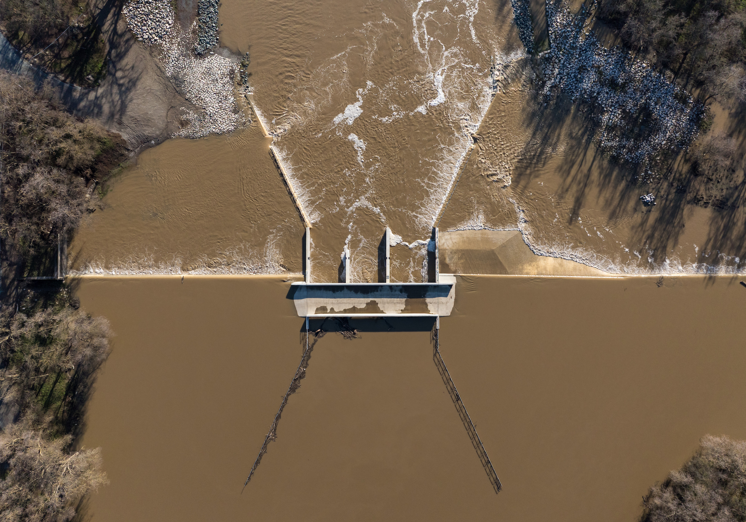 aerial view of Fremont Weir and Big Notch project over a muddy Sacramento River