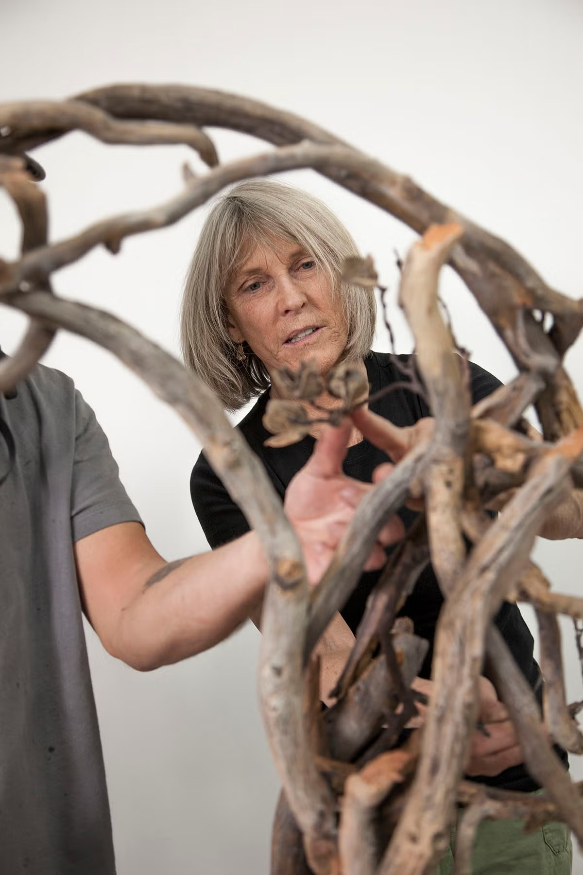Woman pictured behind a sculpture