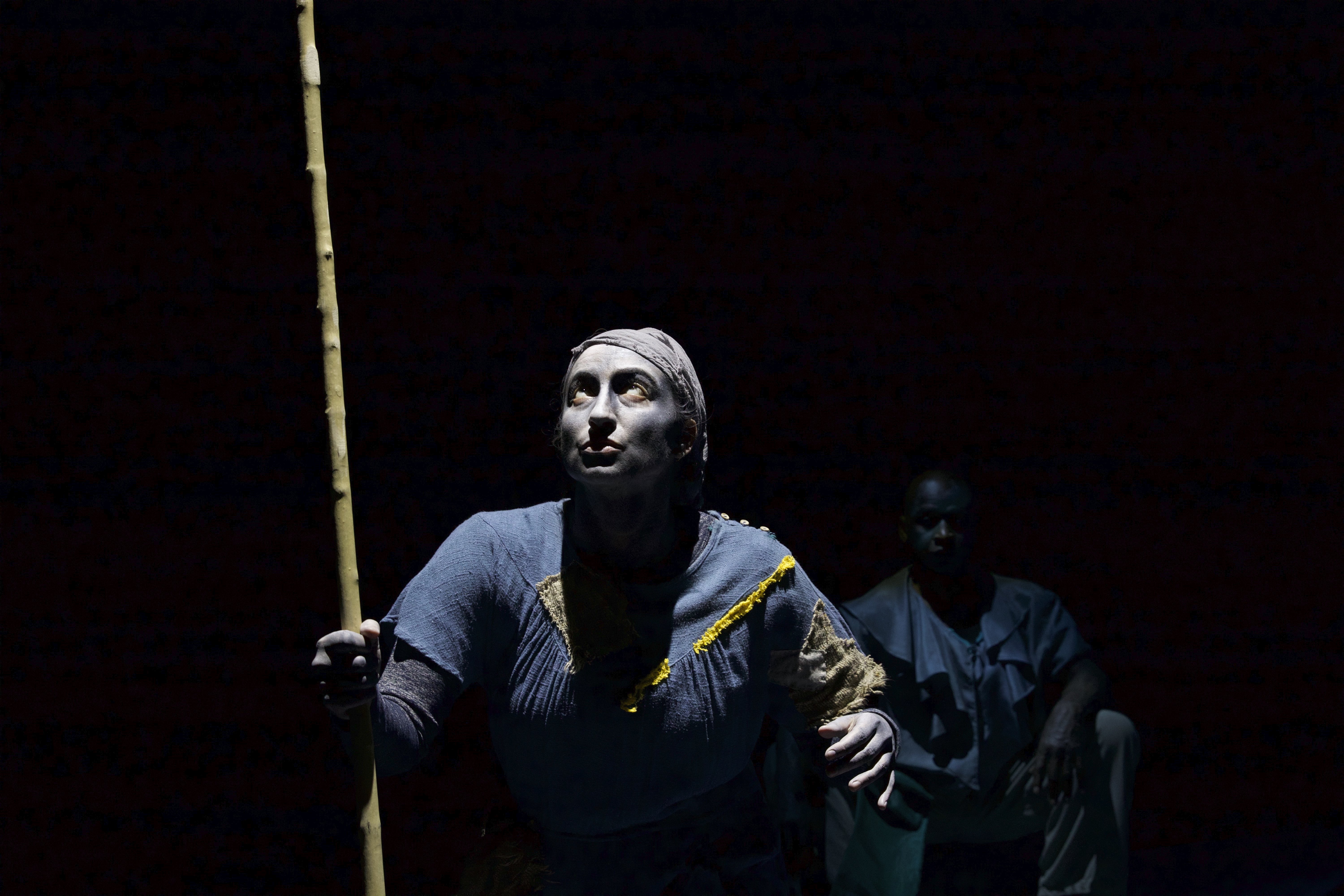 Stage photo of actor with dark background