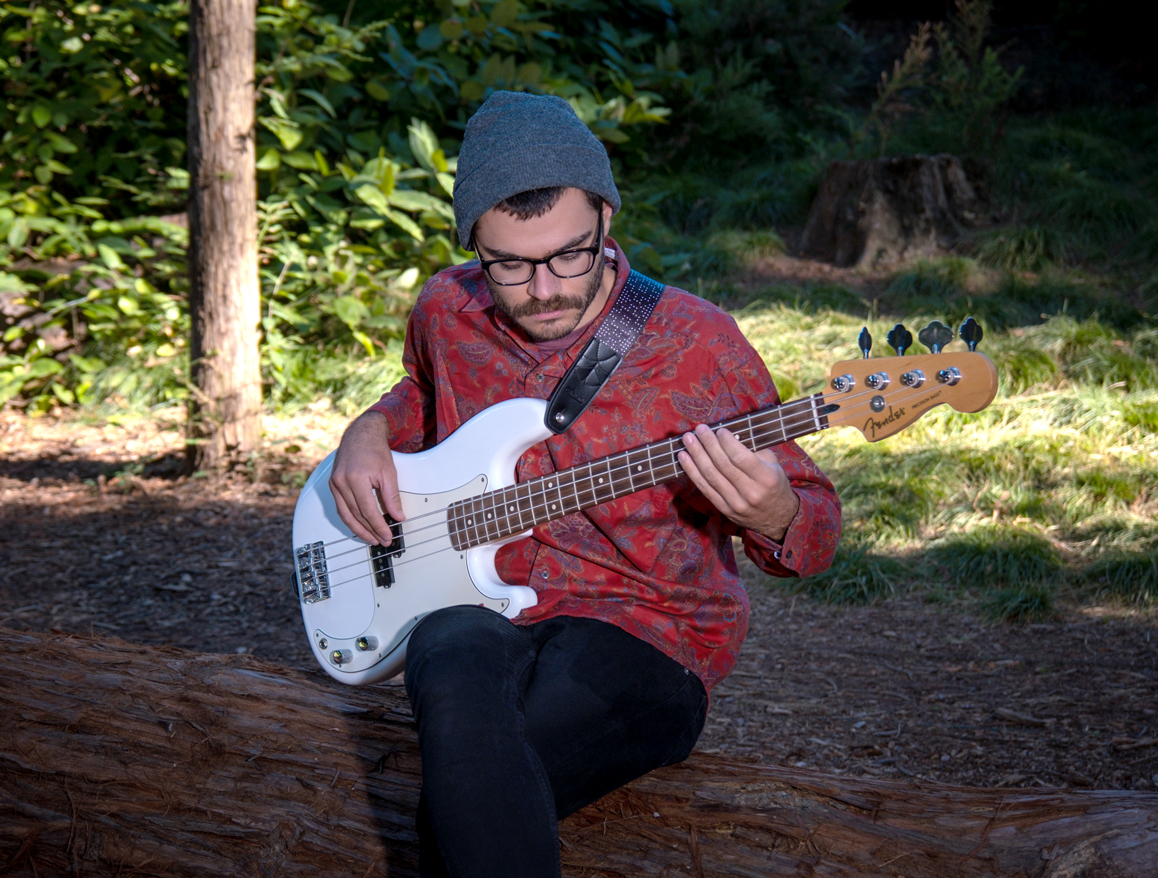 Man playing guitar in UC Davis arboretum