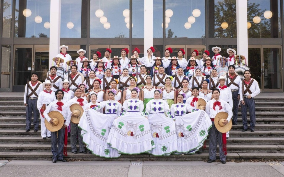 Ensemble in costume in front of Mondavi Center