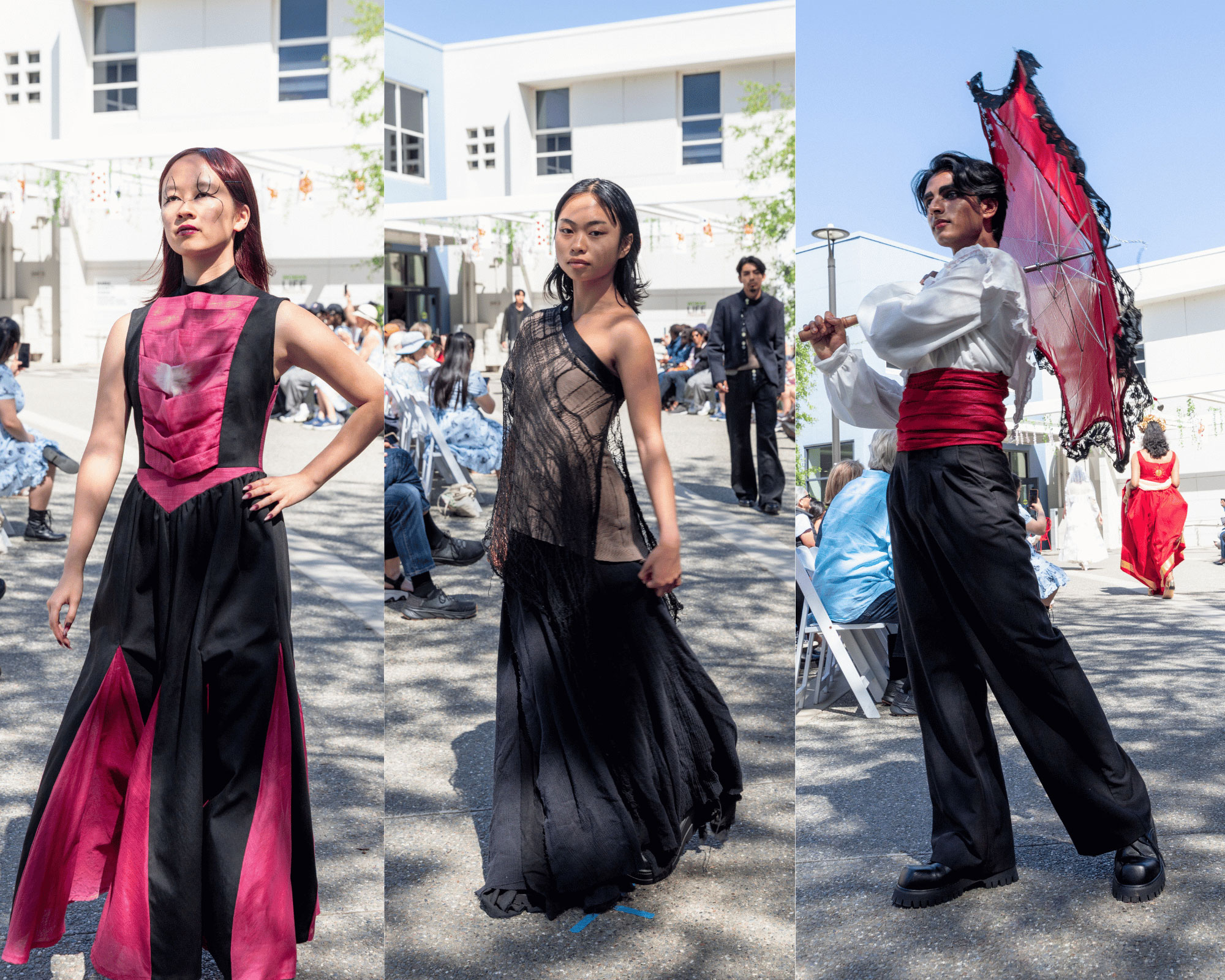 Three festival dancers in flowing black, magenta, and red costumes performing outdoors