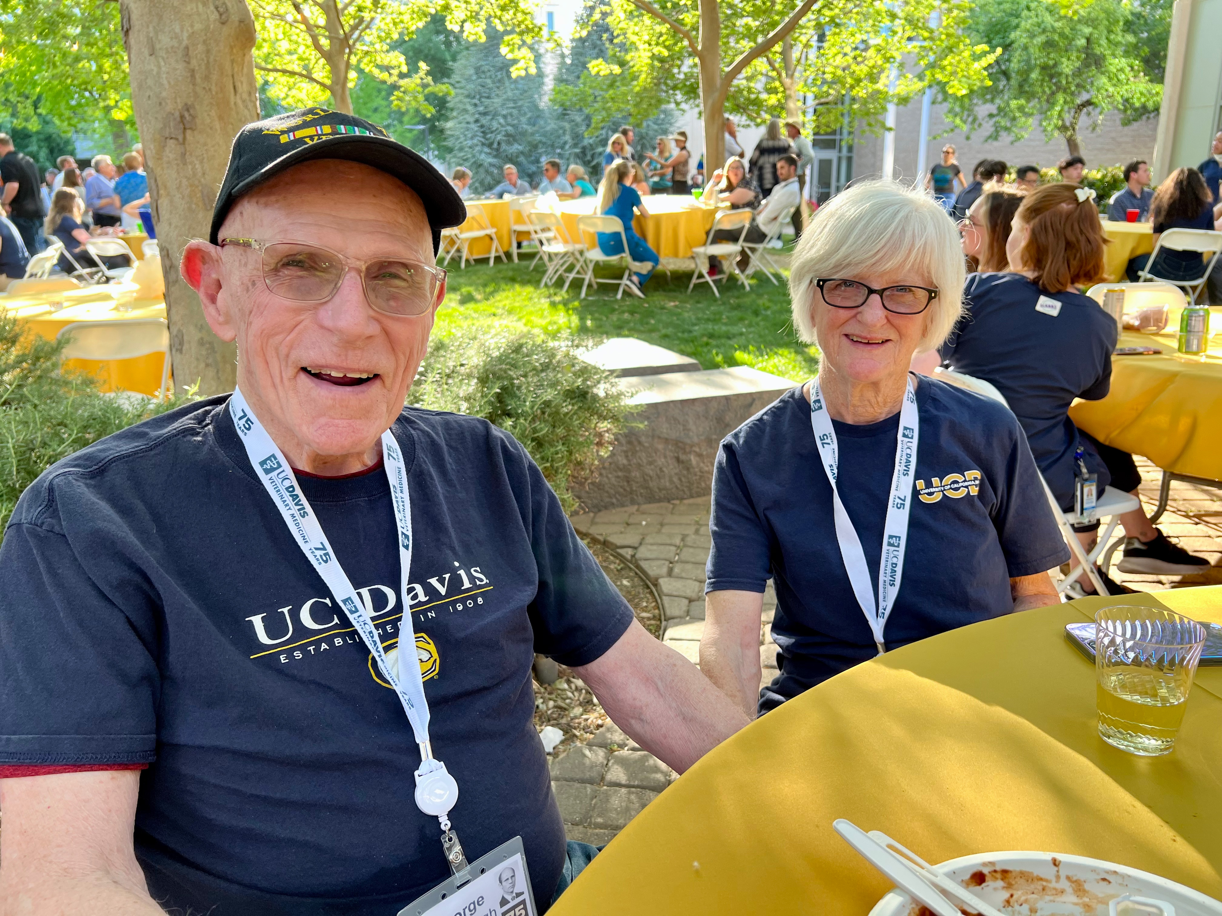 Man and woman sitting at table outside