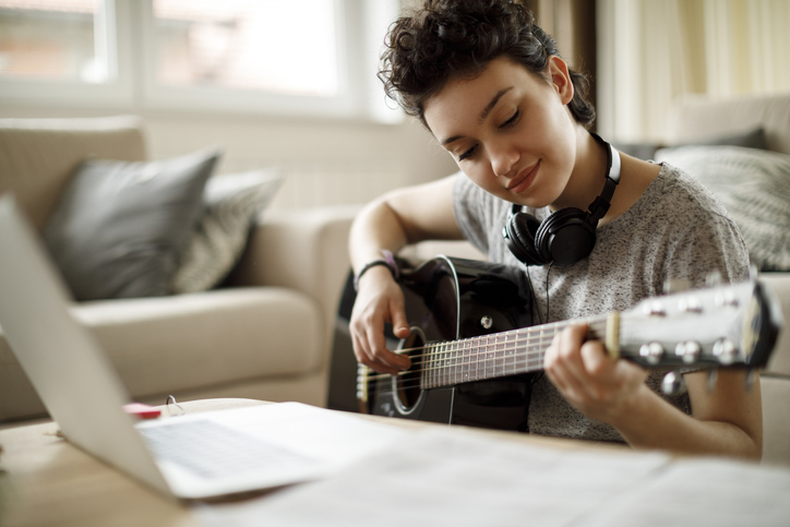 Young person playing musical instrument