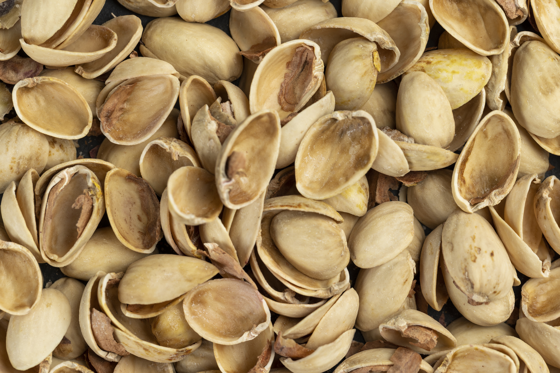 full frame of discarded pistachio shells