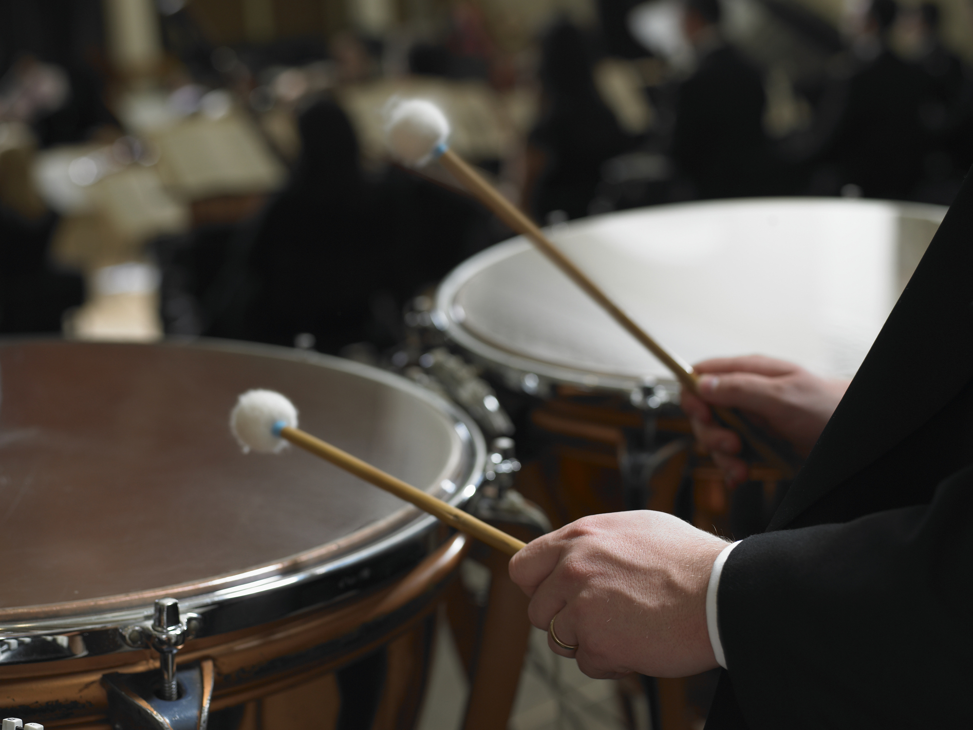 drums and persons hands illustrating drumming