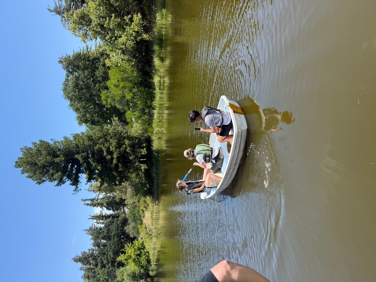 Students explore the UC Davis arboretum in small boat. (Courtesy)