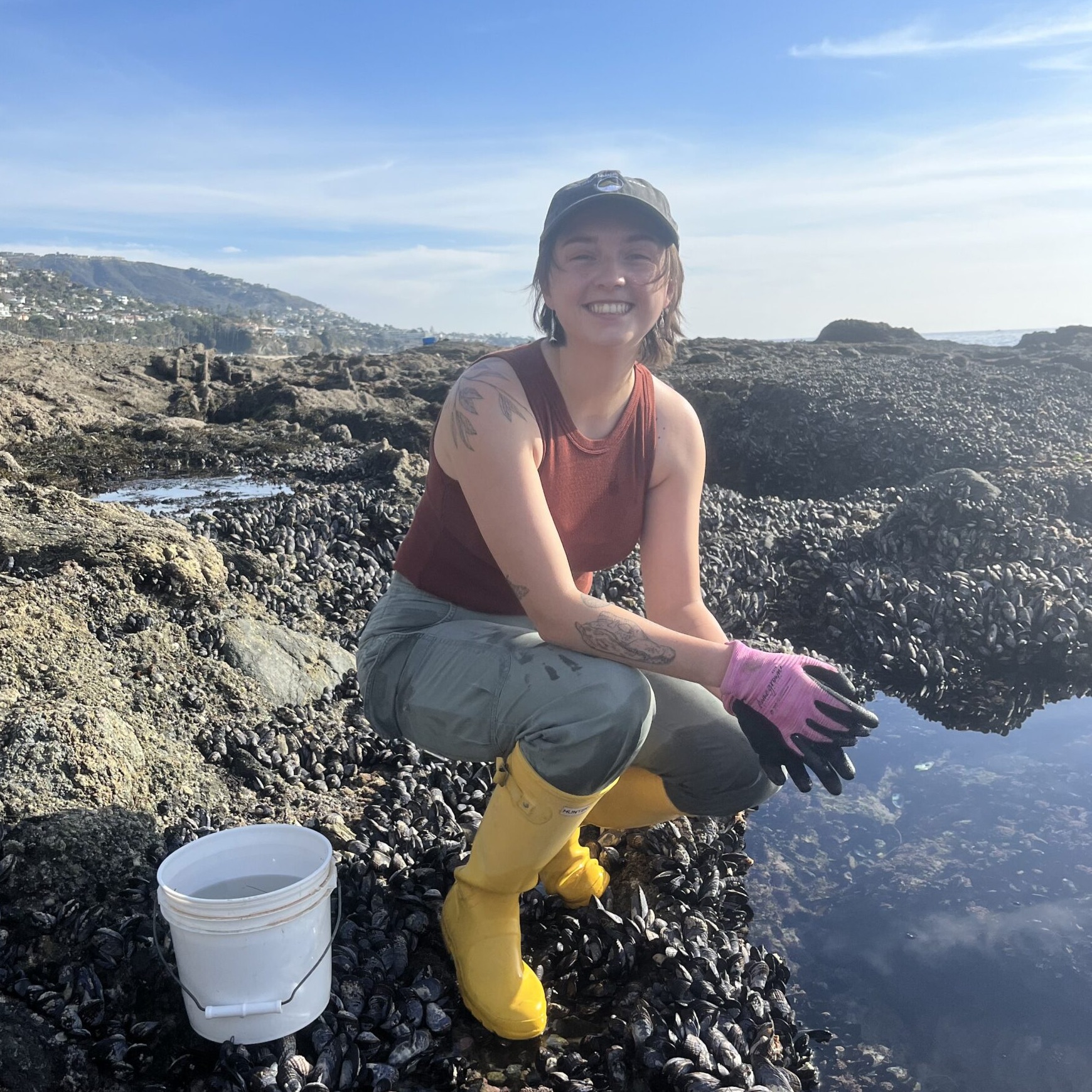 Madison Armstrong posing in front of tidepools