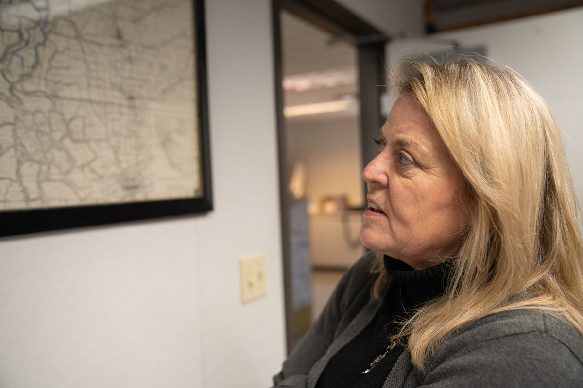 Kathleen Schaefer looks at map of Isleton on the wall