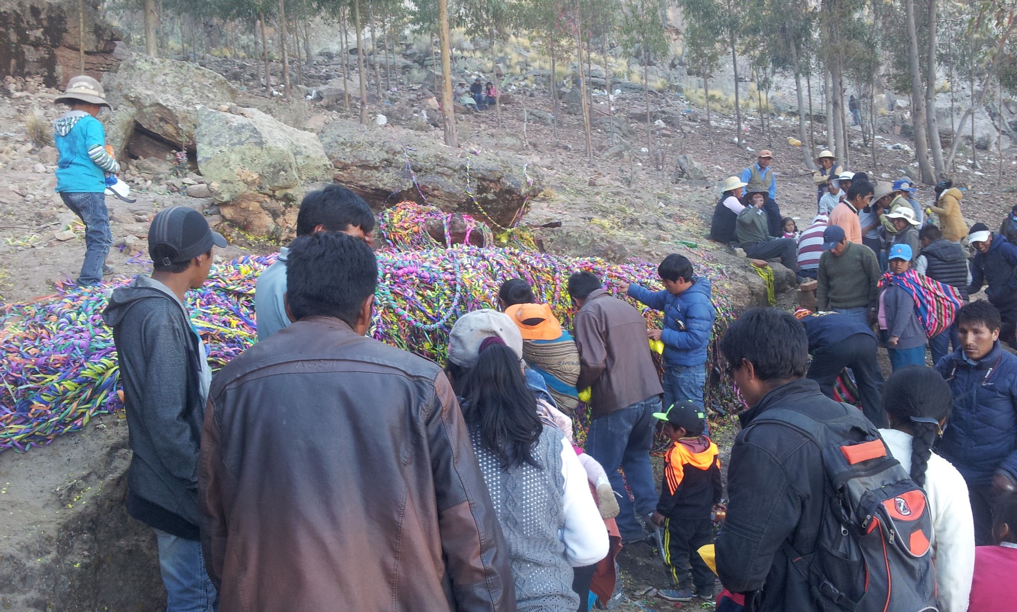 Pilgrims lay confetti and streamers across the opening of a nearby rock formation representing a mine. (Cristina Moya, Courtesy)