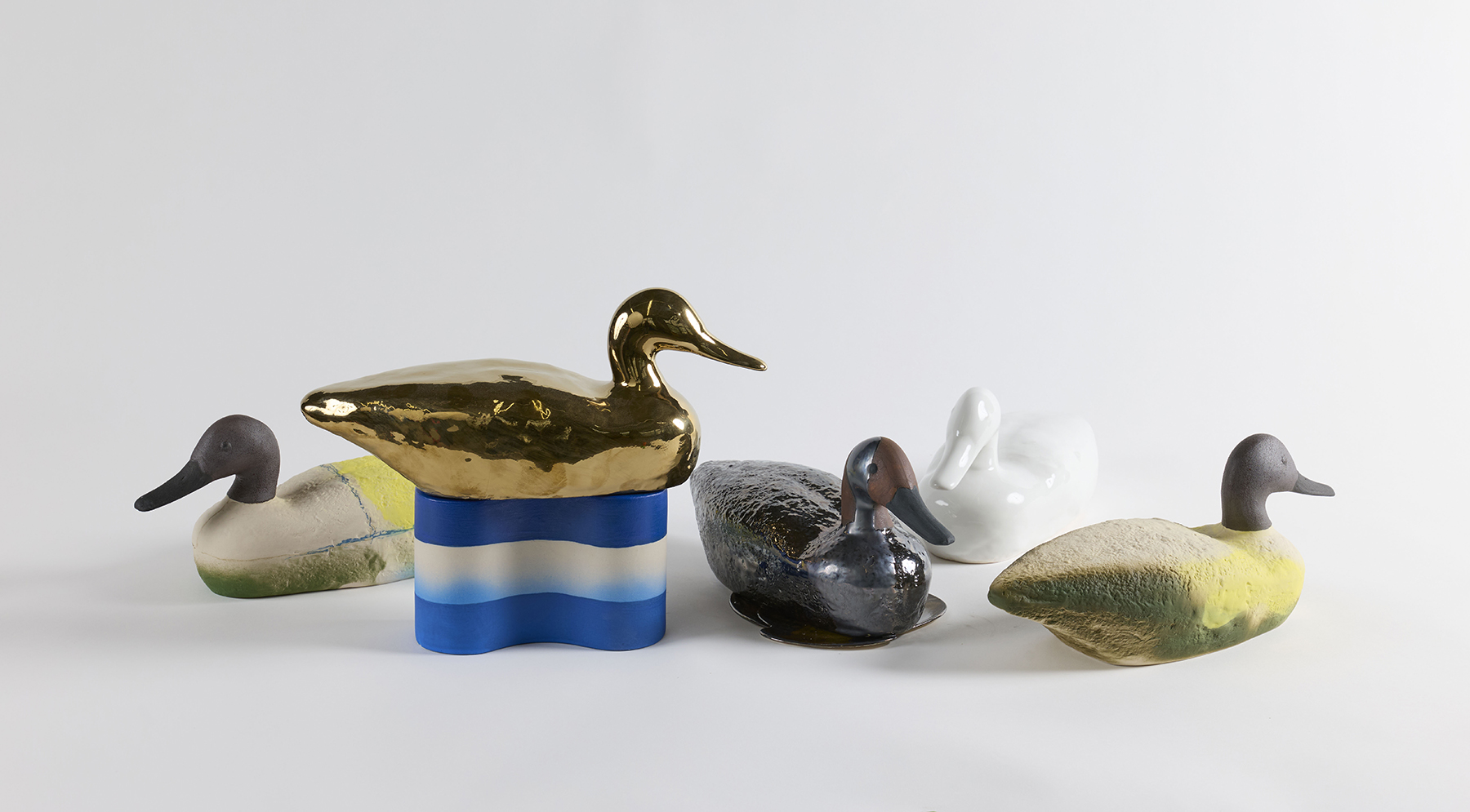 duck decoy sculptures colorfully painted