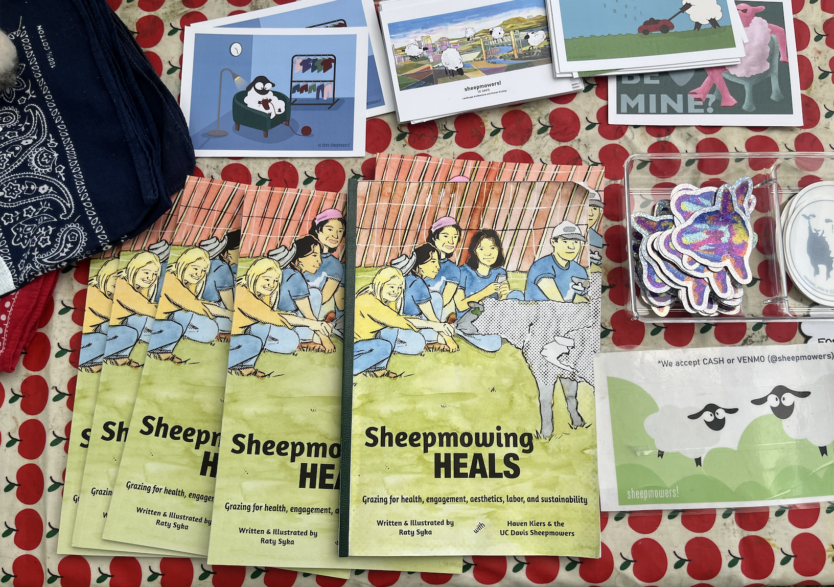 Some of the pamphlets and stickers avaliable at the Sheepmowing booth. (Jamie Gelfond/ UC Davis)
