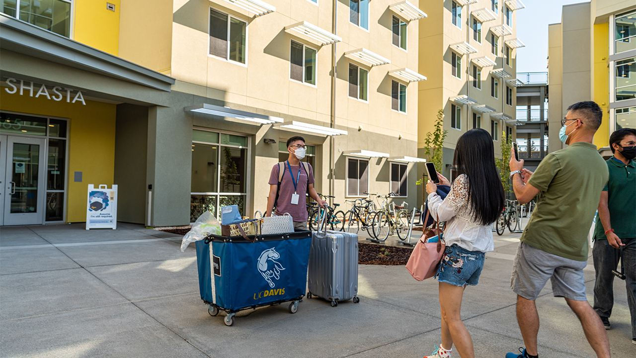 A student poses for a photo outside Shasta Hall in September 2021.