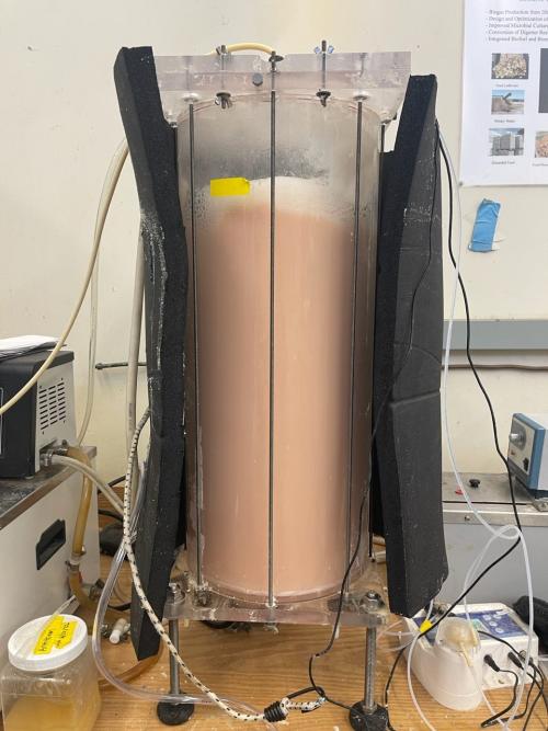 A bioreactor in operation cultivates microbes for bioplastic production