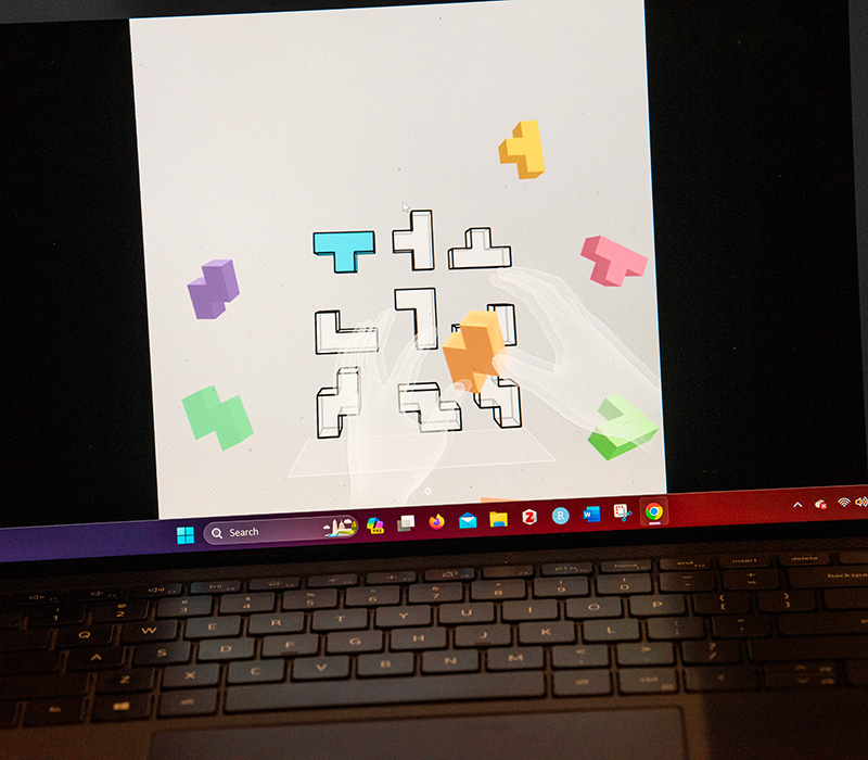 Puzzle pieces on a laptop computer screen