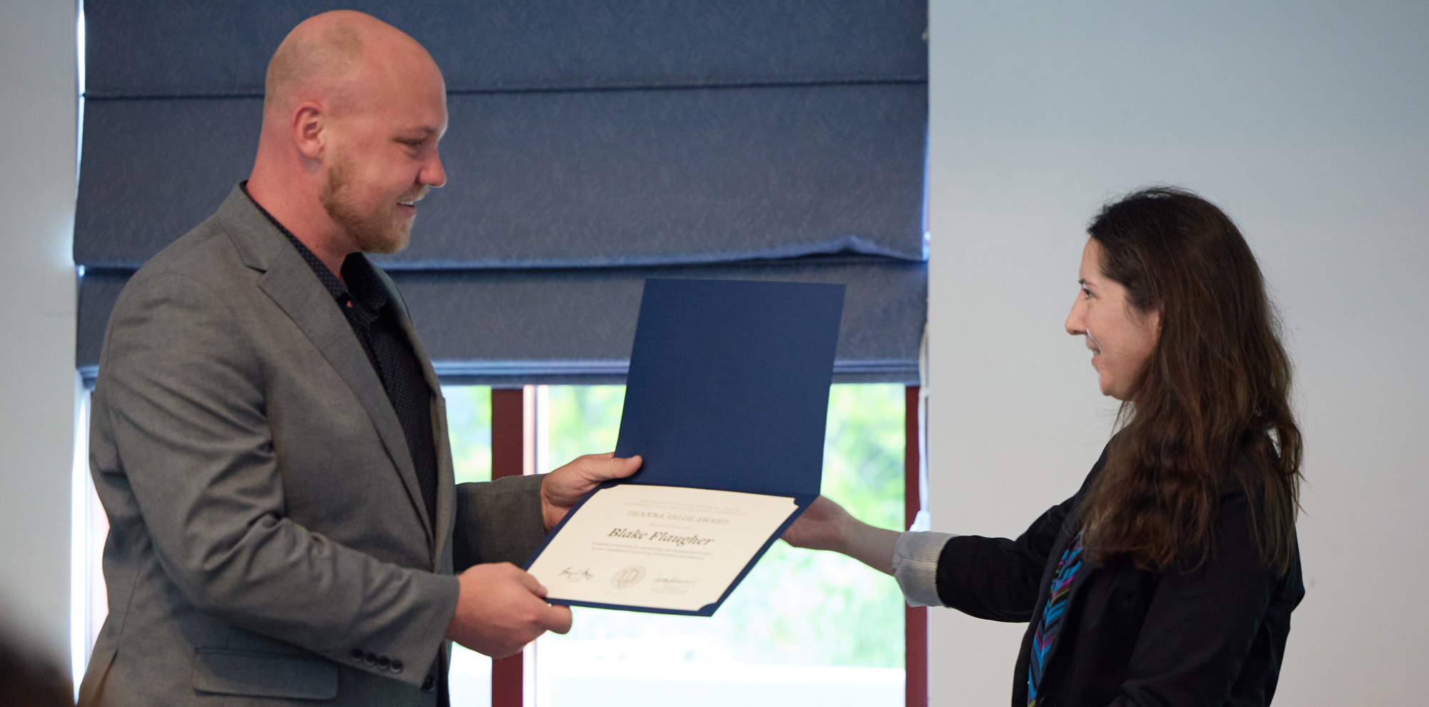 Blake Flaugher receives certificate from Alissa Magorian