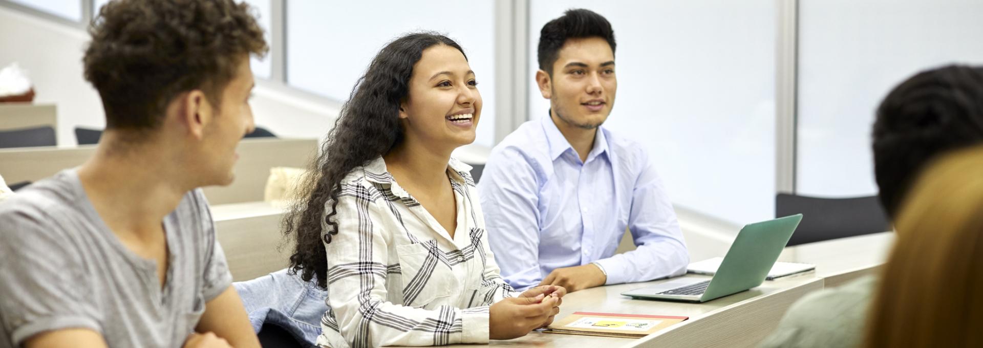 students listening to a presentation in a classroom