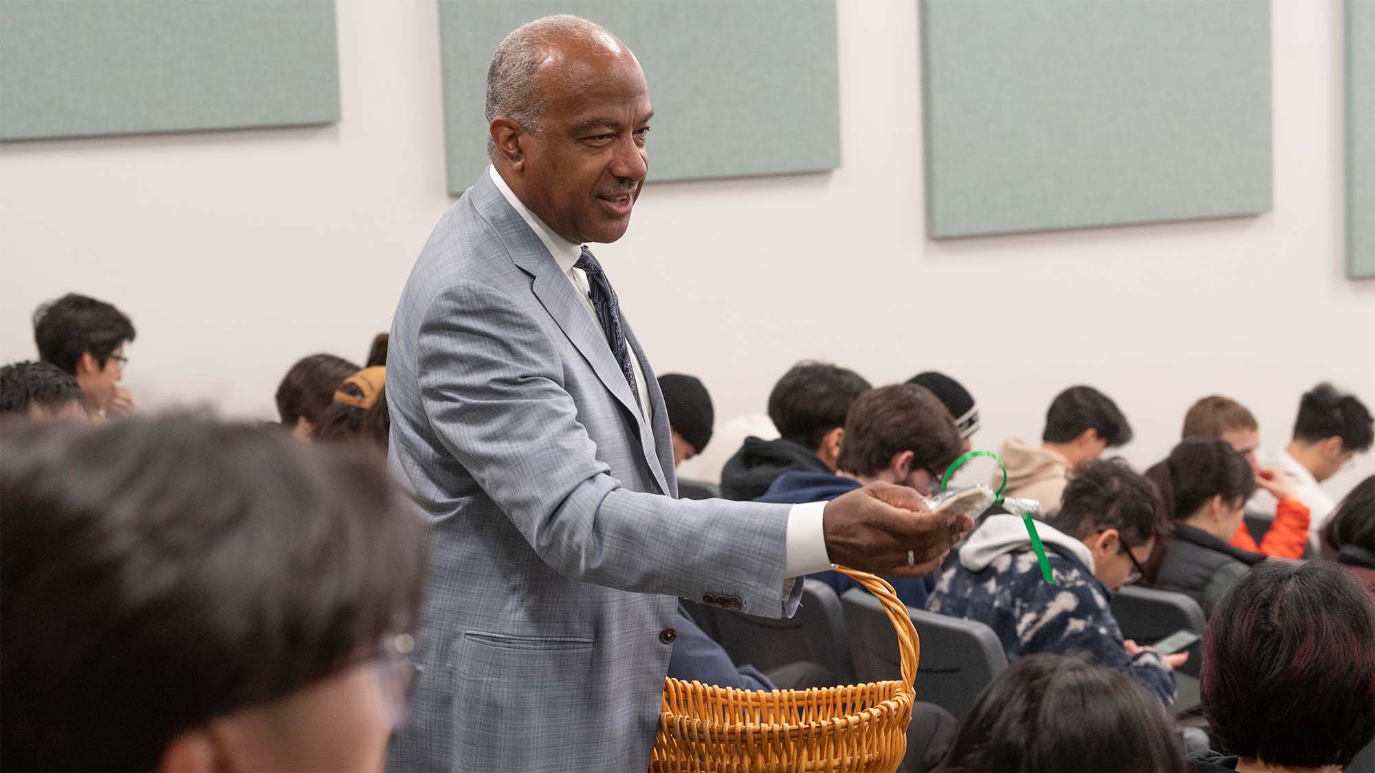Chancellor Gary S. May passes out cookies to students