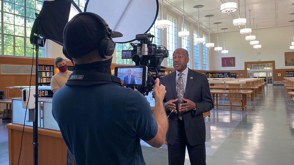 Chancellor Gary S. May speaks as he is being filmed.