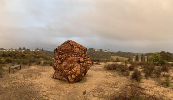 painting that looks pastel with rock in foreground.