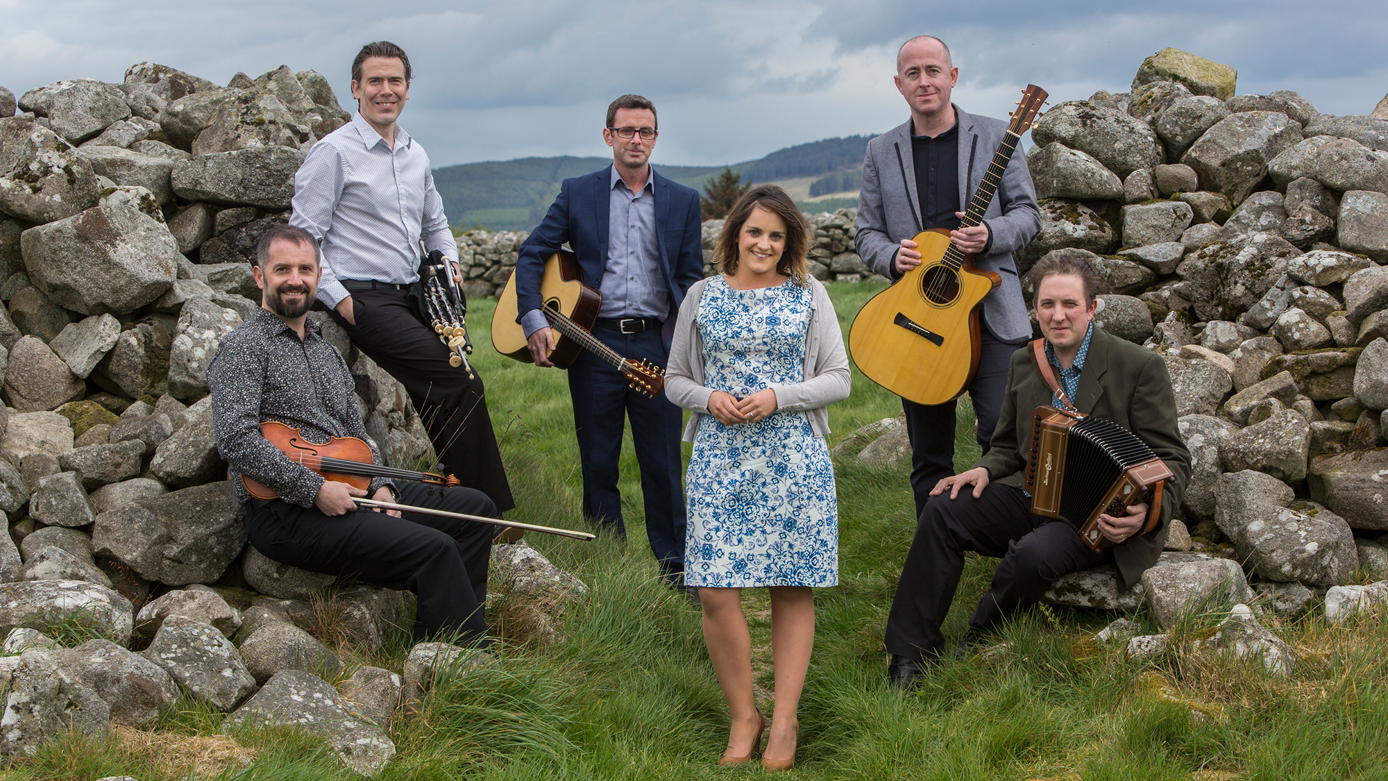 Danu band, outside, amid rock walls