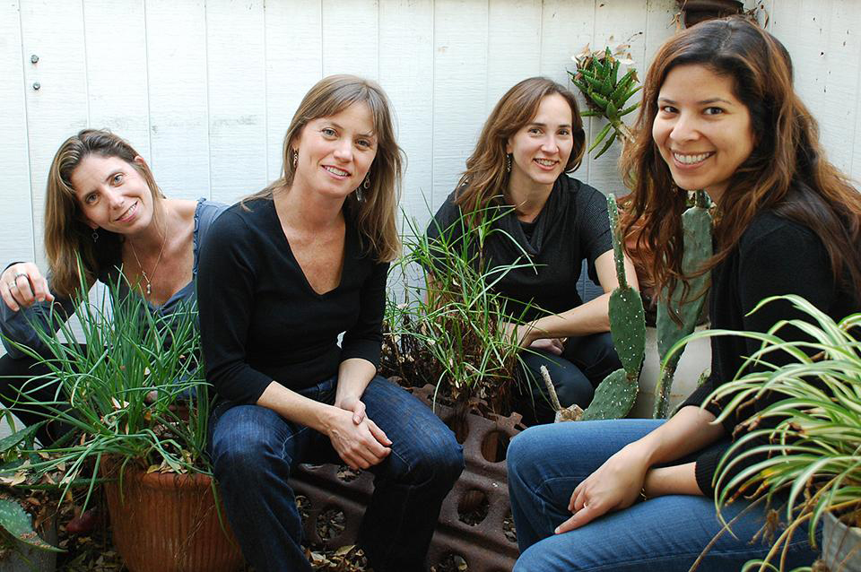 Women squatting in greenery